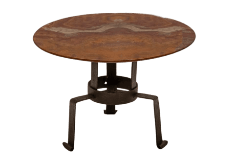A small, round accent table featuring a distinctive reddish-brown variegated stone top supported by a dark, possibly wrought iron, tripod base. The base has a simple, somewhat rustic or industrial aesthetic with three splayed legs that curl outwards at the bottom. — 3D model