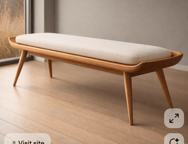 A long, rectangular bench featuring a solid light-colored wooden frame with gracefully curved edges and tapered legs. It is topped with a removable, light cream-colored upholstered cushion. — 3D model
