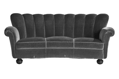 A curved, three-seater sofa upholstered in dark grey velvet. The backrest features a distinctive fluted or channeled design with vertical seams creating segmented panels. The sofa has rolled arms and is supported by short, dark wooden bun feet. — 3D model