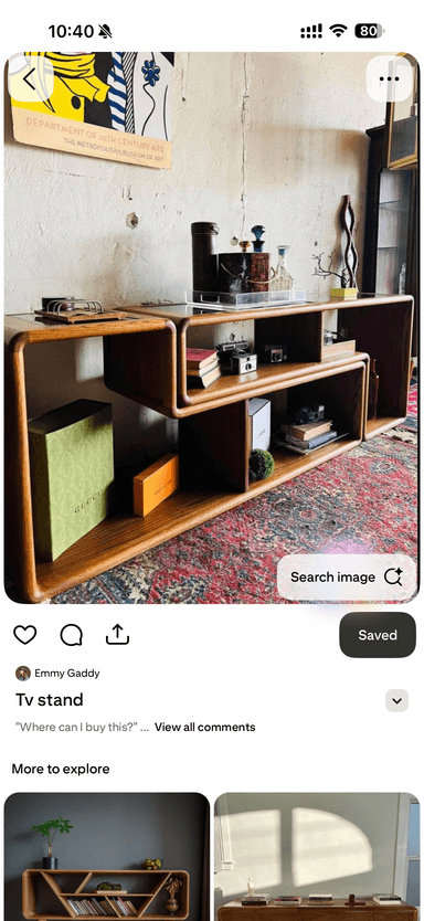A modern media console constructed from bent plywood with a light wood grain finish, featuring two tiers of shelving and integrated smoked glass panels on the top surface. The design incorporates soft, rounded edges and an asymmetrical arrangement of storage compartments. — 3D model