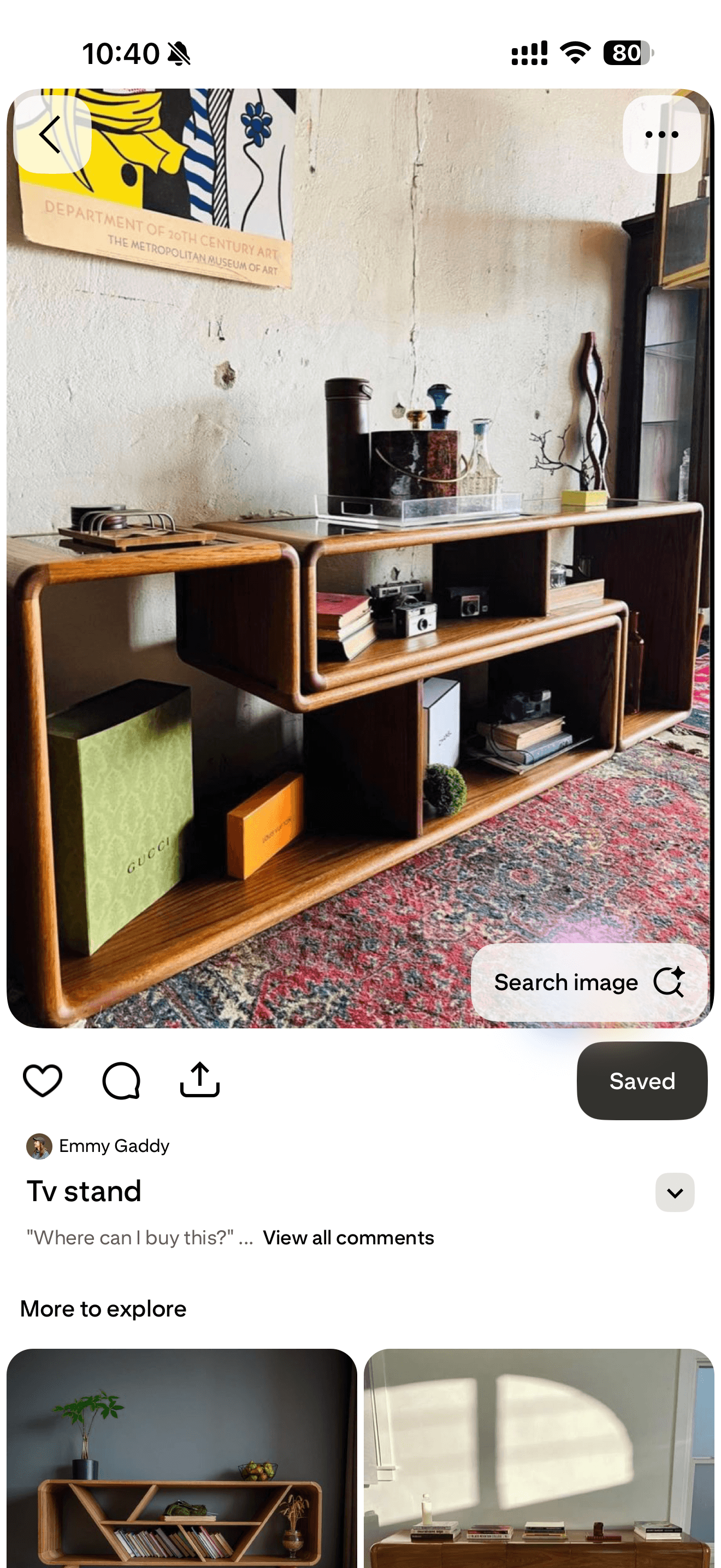 A modern media console constructed from bent plywood with a light wood grain finish, featuring two tiers of shelving and integrated smoked glass panels on the top surface. The design incorporates soft, rounded edges and an asymmetrical arrangement of storage compartments. — 3D model