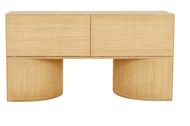 A contemporary console table featuring a rectangular top, two drawers on the front, and two curved leg structures at the base. The drawer fronts and the curved leg structures are covered in woven material, likely rattan or seagrass, giving it a natural texture. The top surface and the framing appear to be made of wood. — 3D model