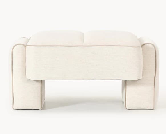 A cream-colored ottoman with a low profile and rounded edges. It features a channel-tufted top and a sturdy base with two distinct leg sections. A thin, darker trim outlines the edges of the upholstery. — 3D model
