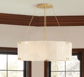 A close-up view of a modern chandelier featuring a circular arrangement of multiple exposed bulbs within a distinctive textured glass shade. The frame and bulb sockets are made of polished brass. The translucent glass shade has an irregular, possibly octagonal or faceted shape, and appears to be made of 'seedy' or artisanal glass, secured by visible brass fasteners around its upper edge. — 3D model