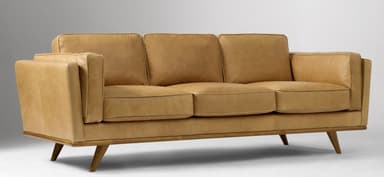 A three-seater sofa with a low profile and square arms. The sofa features upholstered cushions for the back and seat, with piping detail along the edges. It is supported by a wooden frame with tapered legs. — 3D model