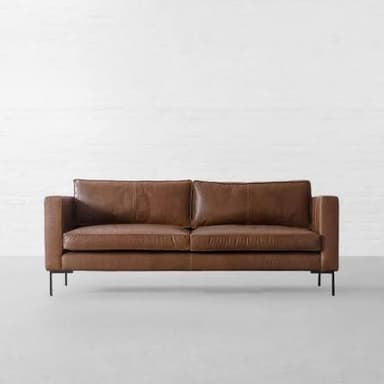 A modern two-seater sofa featuring clean lines, track arms, and upholstered in a rich brown leather. It has two loose seat cushions and two loose back cushions, and is supported by slender black metal legs. — 3D model