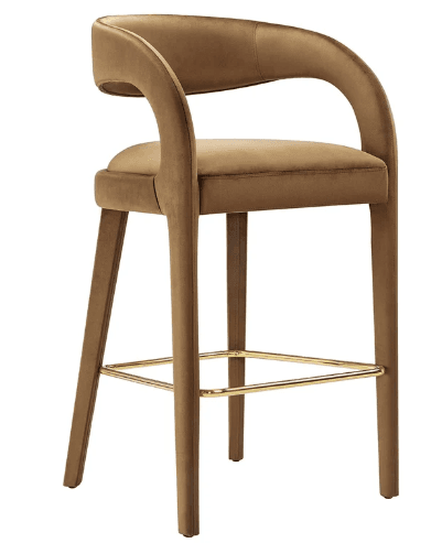 A contemporary bar stool upholstered in camel brown velvet, featuring integrated curved armrests and a polished brass footrest. — 3D model