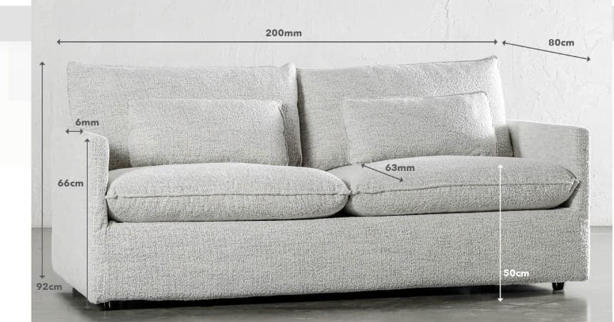 A light grey, contemporary two-seater sofa with a relaxed, deep-seated design. It features plush back cushions, two smaller rectangular throw pillows, and wide, low arms. The upholstery is a textured, light-colored fabric, and the sofa has a low profile, resting on discreet, recessed feet. — 3D model