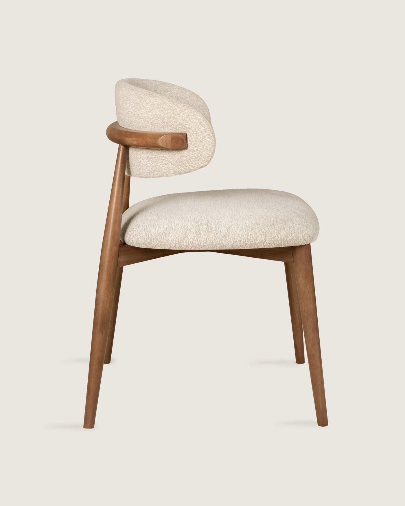 A contemporary dining chair featuring an upholstered seat and a curved, integrated backrest with small wooden arm supports, all supported by a solid wooden frame with tapered legs. — 3D model