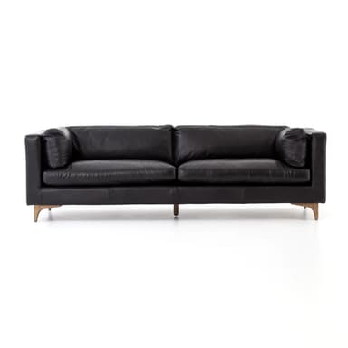 A contemporary three-seater sofa upholstered in black leather, featuring a clean-lined square arm design, loose seat and back cushions, and supported by tapered, light-colored wooden legs. — 3D model