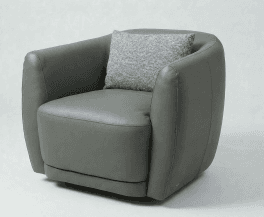 A modern, rounded armchair upholstered in dark gray material, featuring integrated arms and a loose seat cushion. A small, textured throw pillow in a lighter gray is placed on the backrest. — 3D model