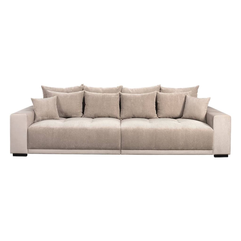 A large, plush contemporary sofa featuring a thick-wale corduroy upholstery in a neutral beige tone. The sofa has a deep seating profile with numerous loose back cushions and accent pillows, all upholstered in matching corduroy. It features wide, squared-off track arms with a slightly different, smoother fabric on the outer sides, suggesting a contrast or different texture. The base is minimalistic, with discreet dark feet. The overall impression is one of comfort and modern casual design. — 3D model
