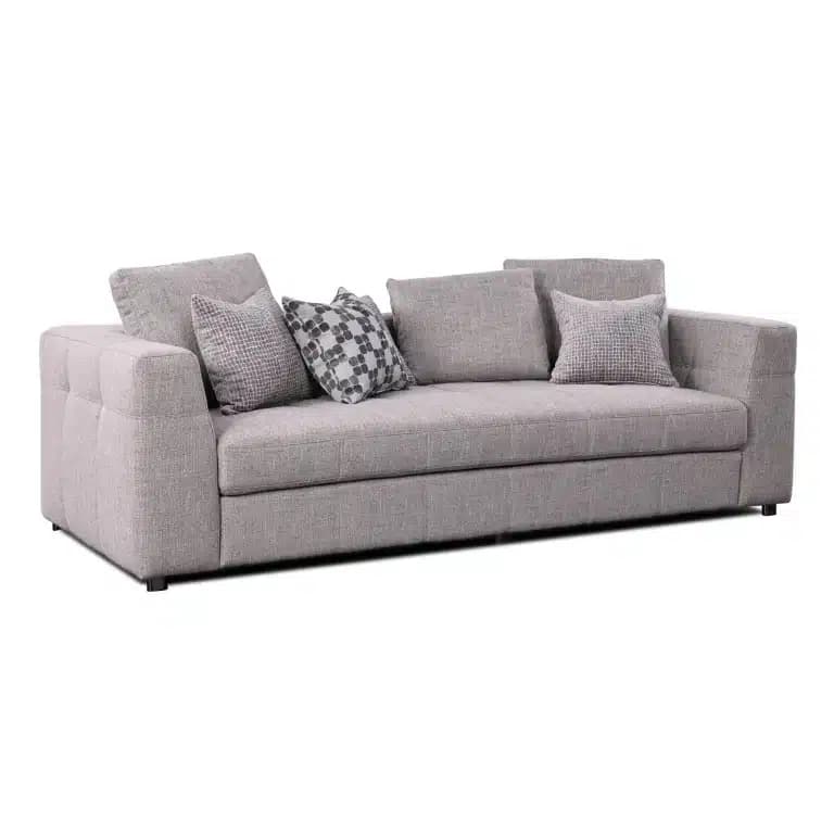 A contemporary three-seater sofa upholstered in a light grey textured fabric, featuring clean lines, track arms with subtle button tufting on the exterior, and generous loose back and seat cushions. It comes with four decorative throw pillows in coordinating grey tones and patterns. — 3D model