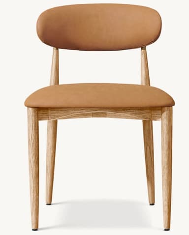 A contemporary dining chair featuring a light oak wood frame and light brown upholstered seat and backrest. The design is minimalist with tapered legs and gently curved padded elements. — 3D model