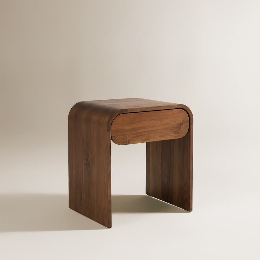 A compact wooden nightstand or side table crafted from bentwood, featuring a continuous curved form that integrates the top and sides, and a single, subtly curved-front drawer. — 3D model