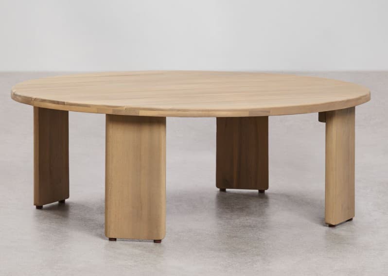 A round, light-colored wooden coffee table featuring a top constructed from multiple planks and supported by a series of four substantial, rectangular block legs with softly rounded vertical edges. — 3D model