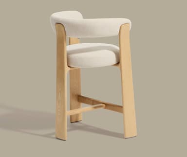 A bar-height or counter-height stool featuring a light-colored wooden frame with horizontal stretchers serving as footrests, and a fully upholstered, U-shaped yellow cushion forming both the seat and the integrated backrest and armrests. — 3D model