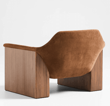 A modern armchair featuring a sculptural form, constructed from solid wood paneling and soft upholstered cushions. The chair exhibits a unique design where the upholstered seating surface, backrest, and integrated armrests form a continuous, curved U-shape, appearing to float within a sturdy, vertical walnut wood panel frame. — 3D model