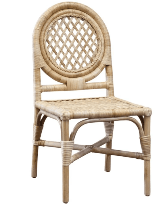 A light-colored, woven rattan chair with a rounded backrest featuring a circular lattice pattern and a woven seat. The frame is constructed from curved rattan poles, with additional bracing between the legs. — 3D model