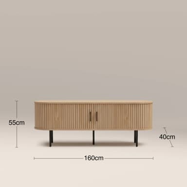 A modern low-profile media console or sideboard cabinet, featuring a natural light wood finish with a distinctive reeded facade, dark metal handles, and slender black metal legs. It has a rounded rectangular form and measures 160cm wide, 55cm high, and 40cm deep. — 3D model