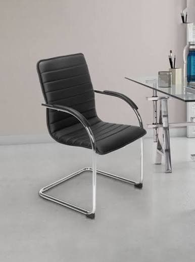 A modern sled-base office guest chair featuring black ribbed upholstery and a polished chrome-plated metal frame. The seat and backrest are padded with horizontal channel tufting, and the arms are integrated into the frame with black padded armrests. — 3D model