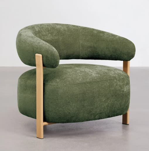 A contemporary armchair with a rounded, enveloping silhouette. The chair features a curved backrest that extends into armrests, upholstered in a textured, moss-green fabric. The structure is supported by visible, light-colored wooden legs and frame elements, creating a contrasting visual and material blend. — 3D model