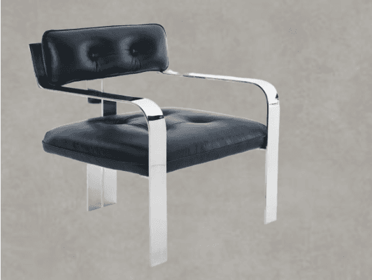 A modern armchair featuring a polished chrome tubular frame and plush black upholstered cushions on both the seat and backrest. The cushions are adorned with button tufting, adding a classic detail to the contemporary design. The frame extends to form integrated armrests and sleek, flat-profile legs. — 3D model