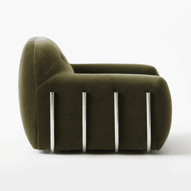A plush, tufted armchair with a rounded silhouette. The upholstery appears to be a soft velvet fabric, and it sits on a minimalist chrome base that curves around the sides, offering a modern contrast to the soft form of the seat and back. — 3D model