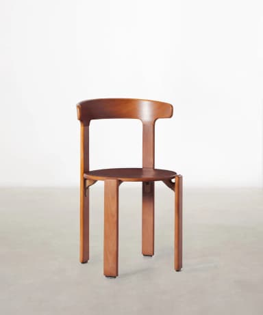 A wooden chair with a curved backrest and a circular seat. The chair has four straight legs. The design appears modern with clean lines and a focus on the natural grain of the wood. — 3D model