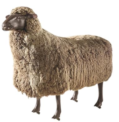 A freestanding, sheep-shaped furniture piece designed to function as an ottoman or stool. Its body is covered in a textured material resembling sheep's wool, while the head and four slender legs are smooth and dark, mimicking natural features. — 3D model