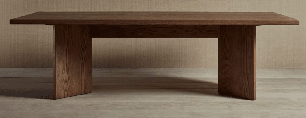 A rectangular, dark brown wooden bench featuring a thick, solid top and two sturdy, block-like legs. The design is minimalist and modern, emphasizing clean lines and a robust appearance. The wood grain is visible, suggesting a natural material or high-quality veneer. — 3D model