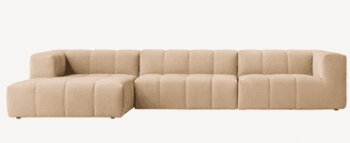 A contemporary modular sectional sofa featuring a right-hand facing chaise lounge, upholstered in a light beige fabric. The design is characterized by its deep channel tufting, creating a distinctive segmented appearance across the seat, back, and arms. The sofa comprises several interconnected units, allowing for flexible configuration, and sits on discreet, low-profile feet. Its plush, rounded form suggests comfort and a modern aesthetic. — 3D model