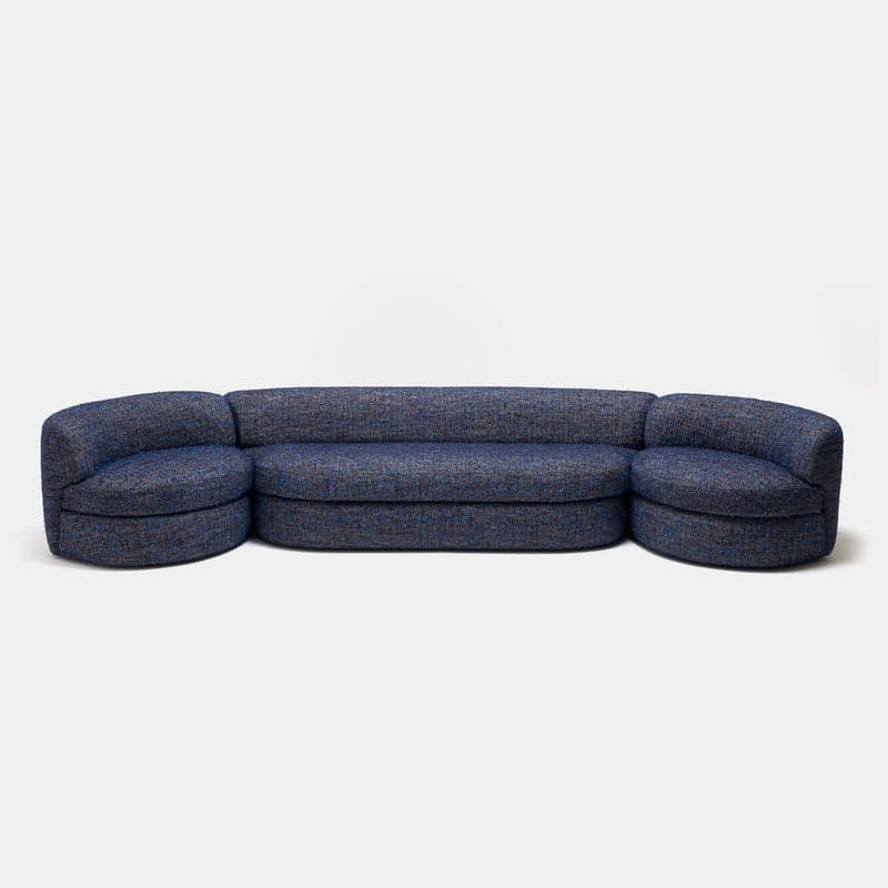 A contemporary curved modular sectional sofa composed of a central armless section and two curved end sections, all upholstered in a multi-tonal blue textured fabric. — 3D model