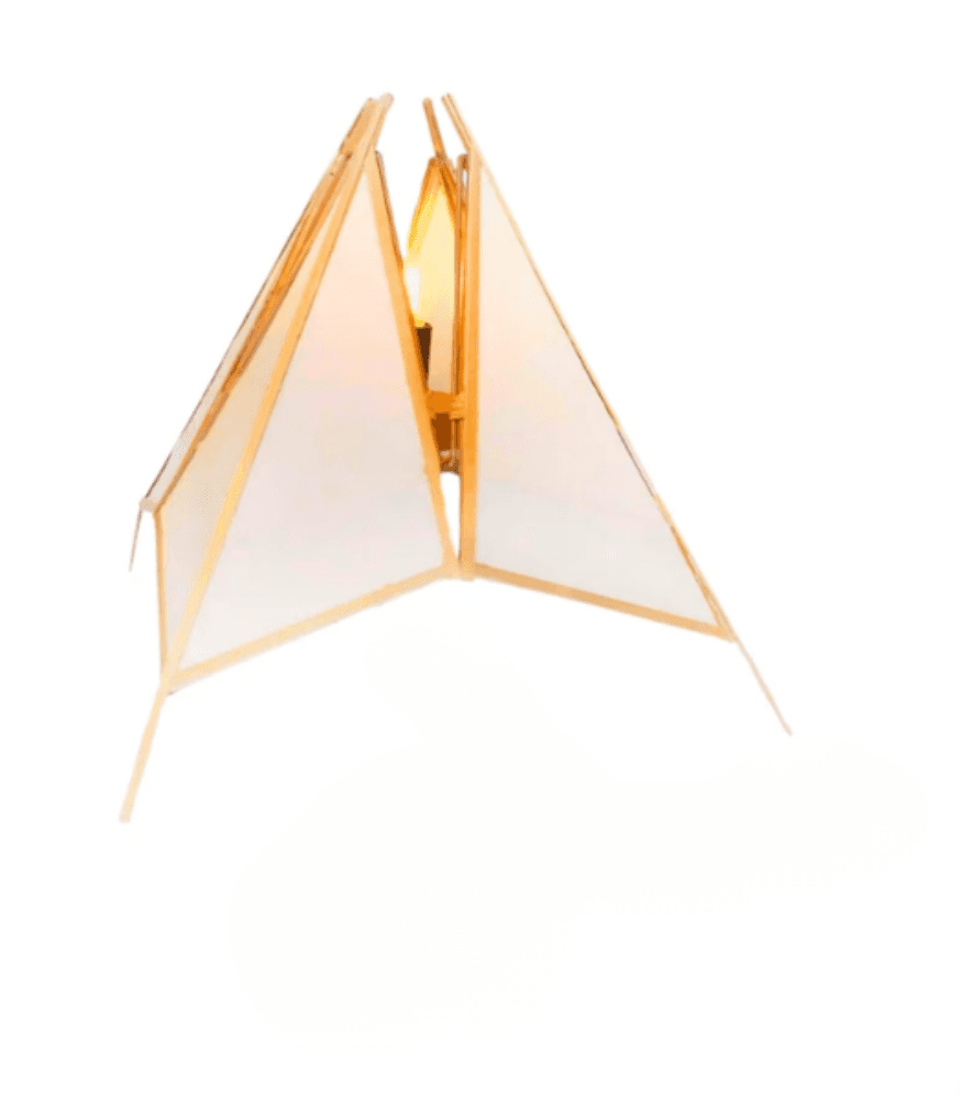 A table lamp featuring a sculptural, geometric shade constructed from light-colored, translucent panels framed by slender wooden or bamboo struts, illuminating with a warm glow from within. — 3D model