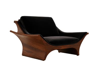 A sculptural lounge chair featuring a dark, richly-grained wood frame with sweeping, organic curves, paired with thick black velvet upholstery. The chair's design is low-slung and wide, emphasizing comfort and a relaxed posture. The backrest and seat cushions are distinct and plush, providing a soft contrast to the hard wooden shell. The frame's continuous lines form the arms and base, giving it a seamless, integrated appearance. — 3D model