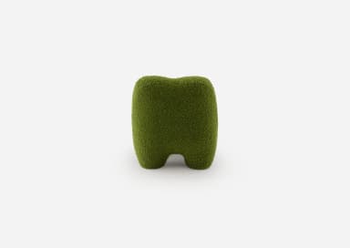 A low-slung, green, organic shaped lounge chair, entirely upholstered in a textured boucle fabric with a sculptural form, devoid of visible legs or distinct base. — 3D model
