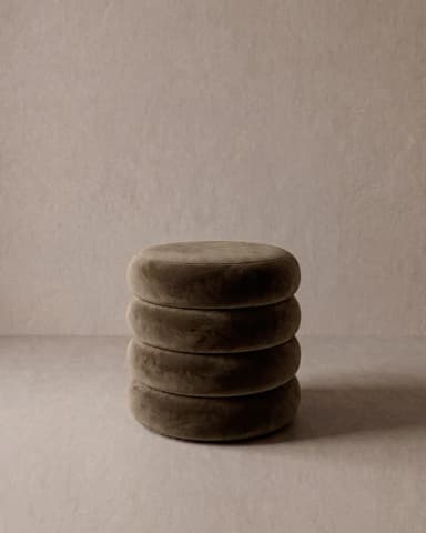 A contemporary, multi-tiered ottoman featuring four stacked, circular upholstered elements. Each tier is plush and soft, suggesting a velvet or similar textile finish. The overall form is cylindrical with gently rounded edges, presented in a neutral taupe or mushroom brown color. It serves as both a decorative accent and a functional seating or footrest piece. — 3D model