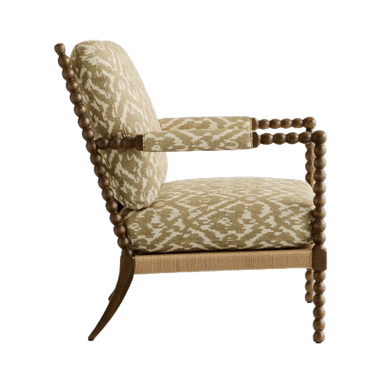 An upholstered armchair featuring a distinctive spool-turned wooden frame, ikat-patterned fabric, and a rope-wrapped seat base. — 3D model