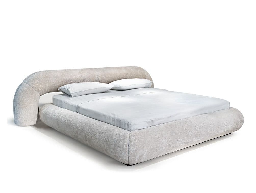 A low-profile bed frame with a rounded headboard that curves around one side. The entire frame appears to be upholstered in a textured, plush fabric. Two white pillows are placed on the mattress. — 3D model