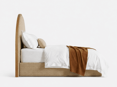 A contemporary bed featuring a distinctive arched headboard constructed with a natural wood frame and a woven cane or rattan insert. The bed base is upholstered in a neutral beige fabric, complementing the natural textures of the headboard. It is shown dressed with crisp white bedding and a warm brown throw blanket. — 3D model