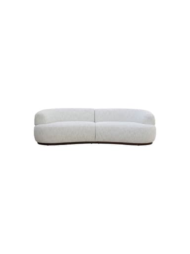 A curved sofa with a rounded armrest on the left side. The sofa features a plush, textured upholstery and a dark, possibly wood, base that follows the organic curve of the seating. — 3D model