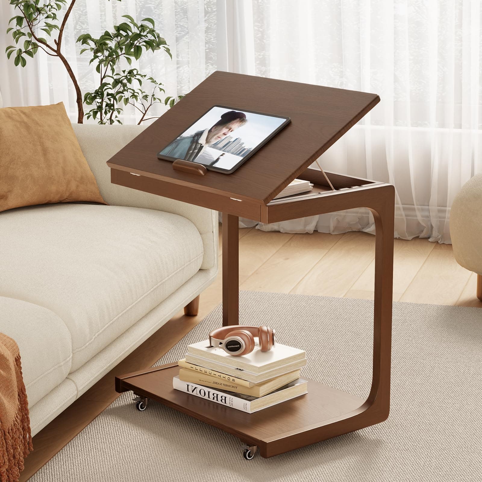 A dark brown wood mobile C-shaped side table featuring a cantilevered design, an adjustable tilting top, and a hidden open storage compartment, all supported by a base with casters for easy mobility. — 3D model