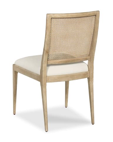 A light-toned wooden dining chair featuring a rectangular backrest with cane webbing and an upholstered seat cushion. — 3D model