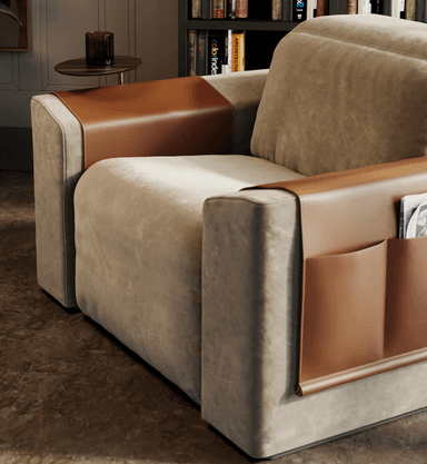 A contemporary recliner chair with a beige fabric upholstery and brown leather accents. The chair features a reclining mechanism, indicated by the extended footrest and visible mechanical components underneath. It includes integrated storage pockets on the side and a small, circular swivel table attached to a metal arm. — 3D model