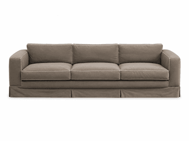 A three-seater sofa upholstered in a neutral taupe fabric, featuring three seat cushions, three back cushions, and wide square arms. The sofa includes a pleated skirted base and light-colored piping detail along all cushion and arm edges. — 3D model
