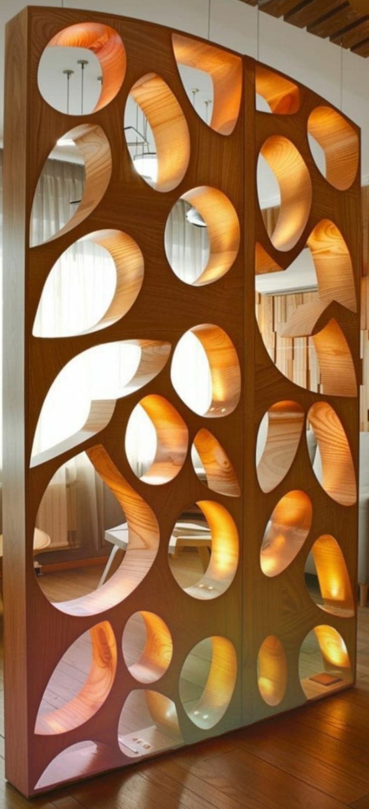 A wooden panel featuring various organic and circular cutouts, designed to divide a space. The wood has a visible grain and a warm tone. — 3D model