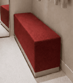 A minimalist, rectangular upholstered bench featuring a deep red fabric top and a contrasting light gray plinth base. — 3D model