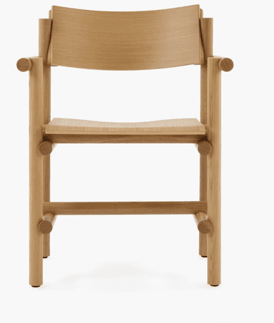 A wooden armchair with a minimalist and modern design. The chair features a curved backrest, a gently sloped seat, and armrests supported by cylindrical elements. The frame is constructed from solid wood with visible joinery, suggesting a focus on craftsmanship and natural materials. The legs are straight and supported by horizontal wooden pieces. — 3D model