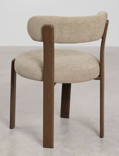 A modern upholstered chair with a wooden frame. The chair features a curved backrest and a round seat, both upholstered in a textured beige fabric. The frame, composed of four legs and supporting structures for the seat and backrest, is made of dark wood with a visible grain. — 3D model