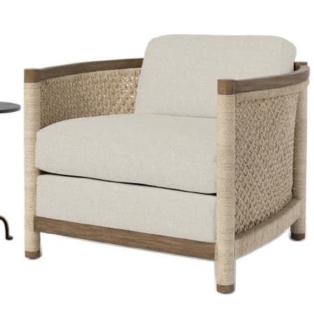 A light-colored armchair with a woven cane or rope back and sides, featuring a wooden frame and upholstered seat and back cushions. The arms are formed by rope-wrapped vertical supports. — 3D model